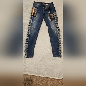 Girls junior jeans size( 5). There are cuts going down both sides of the jeans.